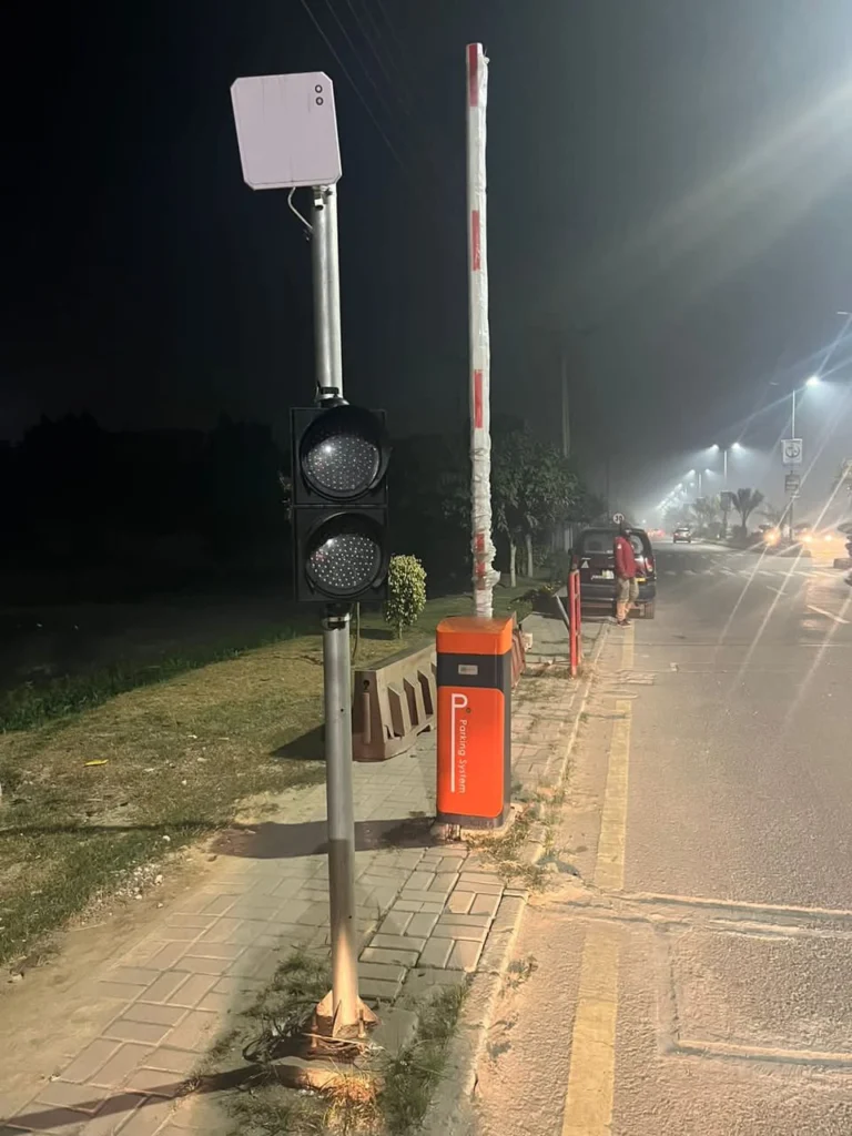 Society entry at night with barrier, RFID reader and signal light